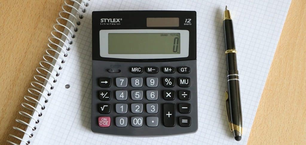 calculator with pen and paper
