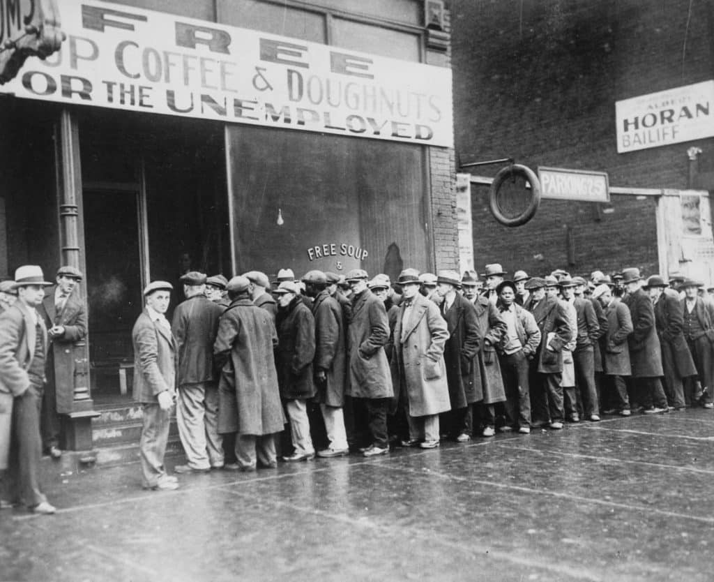 unemployed men standing outside a soup kitchen during the depression